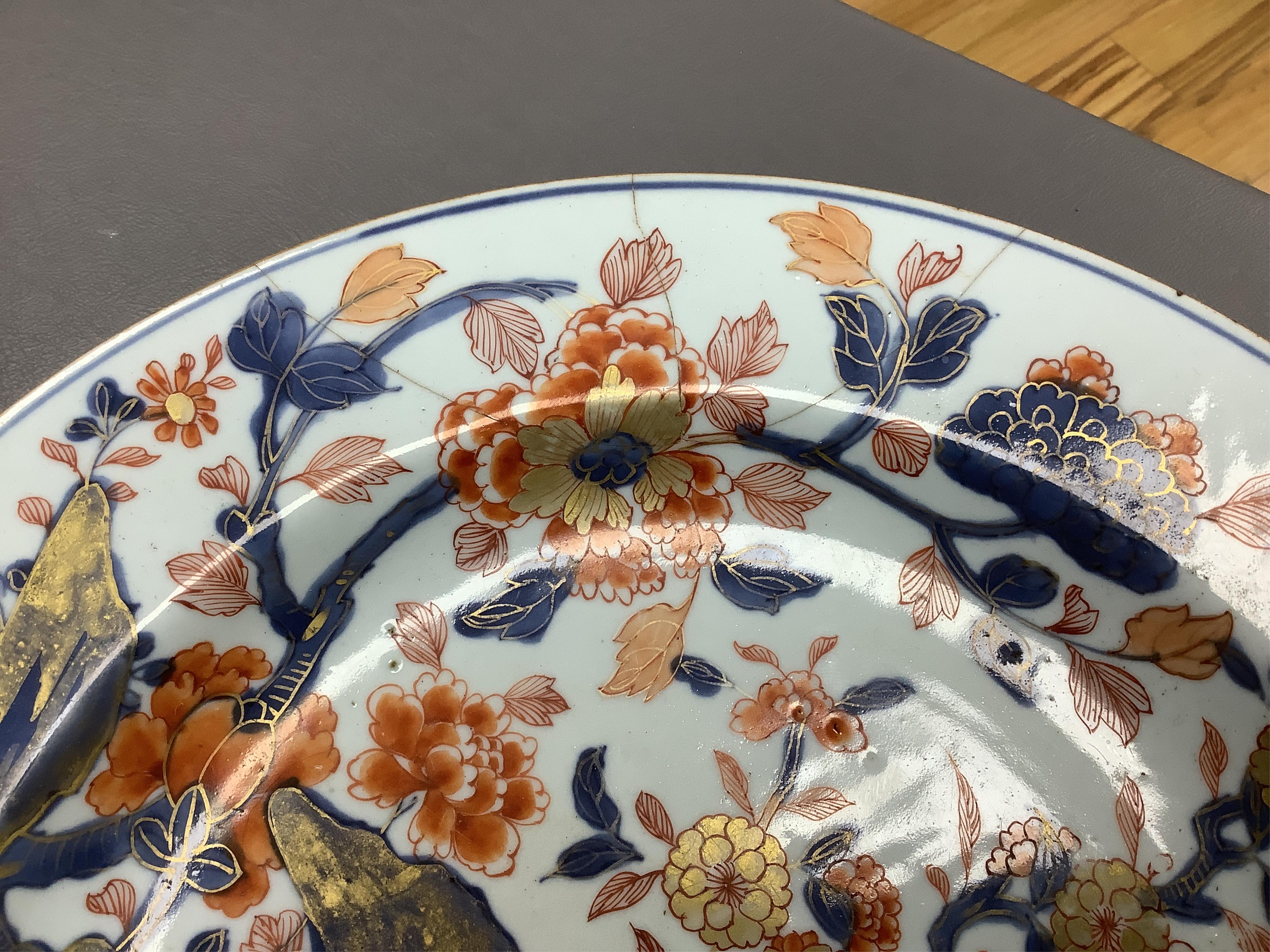 Three early 18th century Chinese Imari dishes (one clobbered), largest 46.5cm, together with a 19th century Chinese powder blue ground vase, 44cm high and a horn carving, 13.7cm (5)